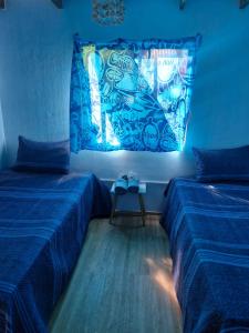 Ένα ή περισσότερα κρεβάτια σε δωμάτιο στο Cabaña Pakarati +13 φωτογραφίες