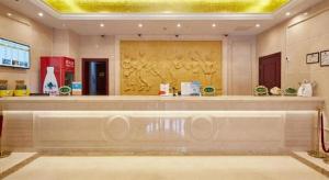 a store lobby with a large counter in a building at Vienna Shanghai Chongming Changxing Island in Dongxing +234 photos
