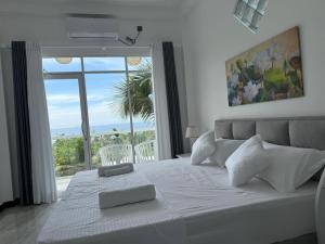 Postel nebo postele na pokoji v ubytování Seaview Mountain Villa