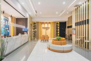 Vstupní hala nebo recepce v ubytování Magnotel Hotel Shanghai Railway Station Magnolia Plaza