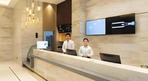 Členové personálu v ubytování City Comfort Inn Guilin City Hall