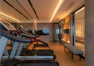 a gym with cardio equipment in a room at Echarm Hotel Nanning Wuxiang Headquarters Base in Nanning +22 photos