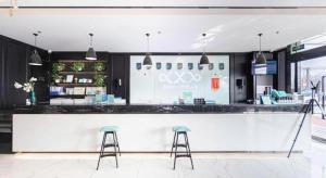 Lounge nebo bar v ubytování Xana Hotelle Binzhou Yangxin