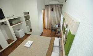 Μια τηλεόραση ή/και κέντρο ψυχαγωγίας στο Hotel Pouso Novo