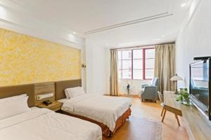 Postel nebo postele na pokoji v ubytování GreenTree Alliance Hotel Shanghai Baoshan District Meilan Lake Yueluo Road + 79 fotografií