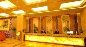 a restaurant with two people sitting at a bar at VX Hotel Chengdu Jiaolong Port Haibin in Chengdu