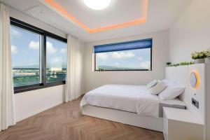 Ένα ή περισσότερα κρεβάτια σε δωμάτιο στο 위드유하우스 +31 φωτογραφίες