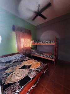 Postel nebo postele na pokoji v ubytování Residencial Mc