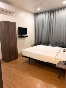 Ένα ή περισσότερα κρεβάτια σε δωμάτιο στο Hotel Lotus +8 φωτογραφίες