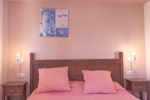 מיטה או מיטות בחדר ב-Oasis Royal