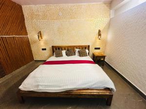 Postel nebo postele na pokoji v ubytování Istaqbal Hotel Mukki