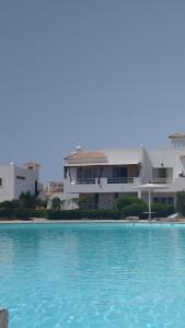 a large swimming pool in front of a house at Naama Bay in Sharm El Sheikh