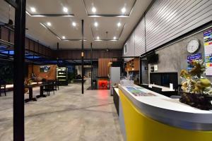 a lobby with a counter and a dining room at The Breeze Lipe Resort in Ko Lipe