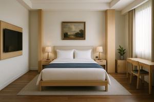 a bedroom with a bed and a desk and a television at Wenjin Culu in Elbasan