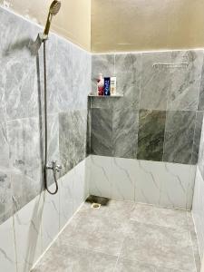 a shower with a glass door in a bathroom at Koh Rong Lagoon in Koh Rong