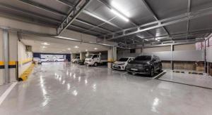 a garage with several cars parked in it at Hotel Primo Daejeon in Daejeon
