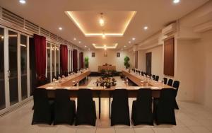 a large conference room with a long table and chairs at Atrium Premiere Cilacap in Cilacap +103 photos