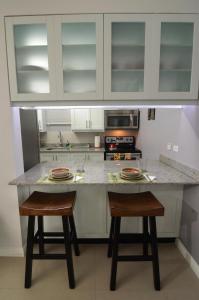 
A kitchen or kitchenette at Choose To Be Happy at Eight - Eight Super Studio Apartments
