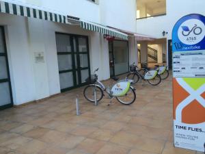 a group of bikes parked outside of a building at Zouglas App Guesthouse in Limassol