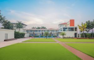 an exterior view of a building with green grass at Zone Connect by The Park Patna 