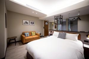 Postel nebo postele na pokoji v ubytování 南兜漫旅