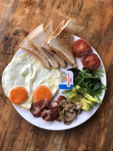 a plate of breakfast food with eggs and toast at Koh Rong Lagoon in Koh Rong Island