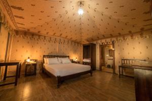 En eller flere senge i et værelse på Kanota Camp Resorts