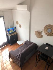 Ένα ή περισσότερα κρεβάτια σε δωμάτιο στο Mazet avec piscine collective