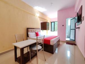 Postel nebo postele na pokoji v ubytování Hotel Pallavi Inn + 5 fotografií