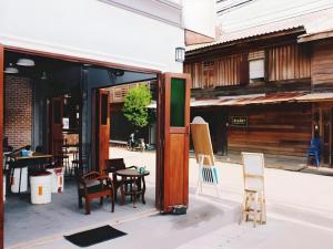 a group of chairs and tables on a patio at Remember Loei Love in Chiang Khan