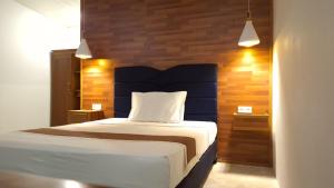 Ένα ή περισσότερα κρεβάτια σε δωμάτιο στο MenTari GuestHouse