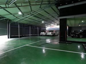 a large garage with two cars parked in it at Java Hotel in Daejeon