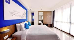 Ένα ή περισσότερα κρεβάτια σε δωμάτιο στο Indies Style Hotel Bandung +179 φωτογραφίες
