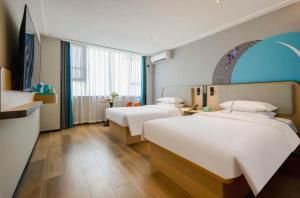 Postel nebo postele na pokoji v ubytování City Comfort Inn Nanning Guangxi University + 212 fotografií