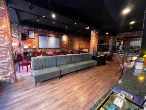 a lobby with a couch and a table and chairs at Sufi Homes in Konya