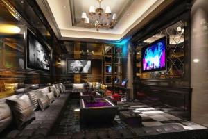 TV a/nebo společenská místnost v ubytování Manhatton Hotel Beihai