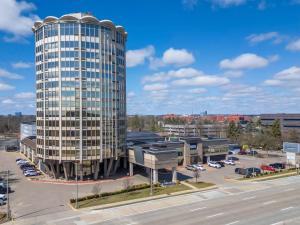 an aerial view of a tall building in a parking lot at Radisson Hotel Southfield-Detroit in Southfield