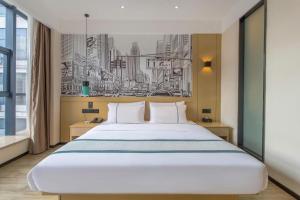 Postel nebo postele na pokoji v ubytování City Comfort Inn Wuhan Baibuting