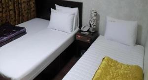 Ένα ή περισσότερα κρεβάτια σε δωμάτιο στο Jongro Nova