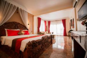 Postel nebo postele na pokoji v ubytování Reaksmey Chanreas Hotel