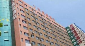 a tall building with balconies on the side of it at 7 Days Premium Laiwu Yingmo Street Branch in Laiwu