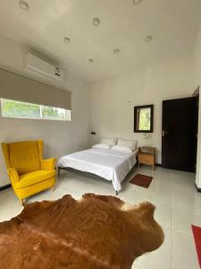 Postel nebo postele na pokoji v ubytování Kandy Brick Bungalow