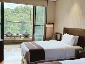 Gallery image of Dujiangyan Xinhua Haiyi Yulei Mountain Residence Hotel in Dujiangyan
