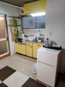 Kuchyň nebo kuchyňský kout v ubytování 波除ハイツ