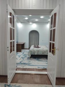 Ένα ή περισσότερα κρεβάτια σε δωμάτιο στο Люкс квартира