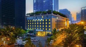 a view of a building in a city at night at Atour Hotel Chengdu High-Tech Zone in Chengdu