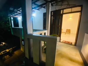 desde el balcón de una casa por la noche en ML villa, en Ahangama