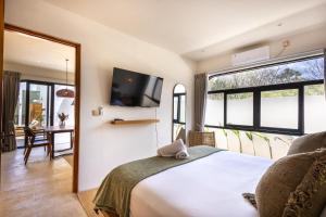 En eller flere senge i et værelse på Thomas Beach Residence + 66 billeder