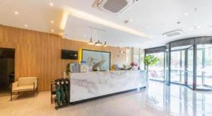 Μια τηλεόραση ή/και κέντρο ψυχαγωγίας στο GreenTree Inn Lu'an Jin'an District Yuanda Xingfuli