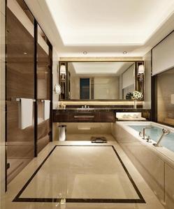 a bathroom with a tub and a large mirror at Wanda Realm Nanjing in Jiangning